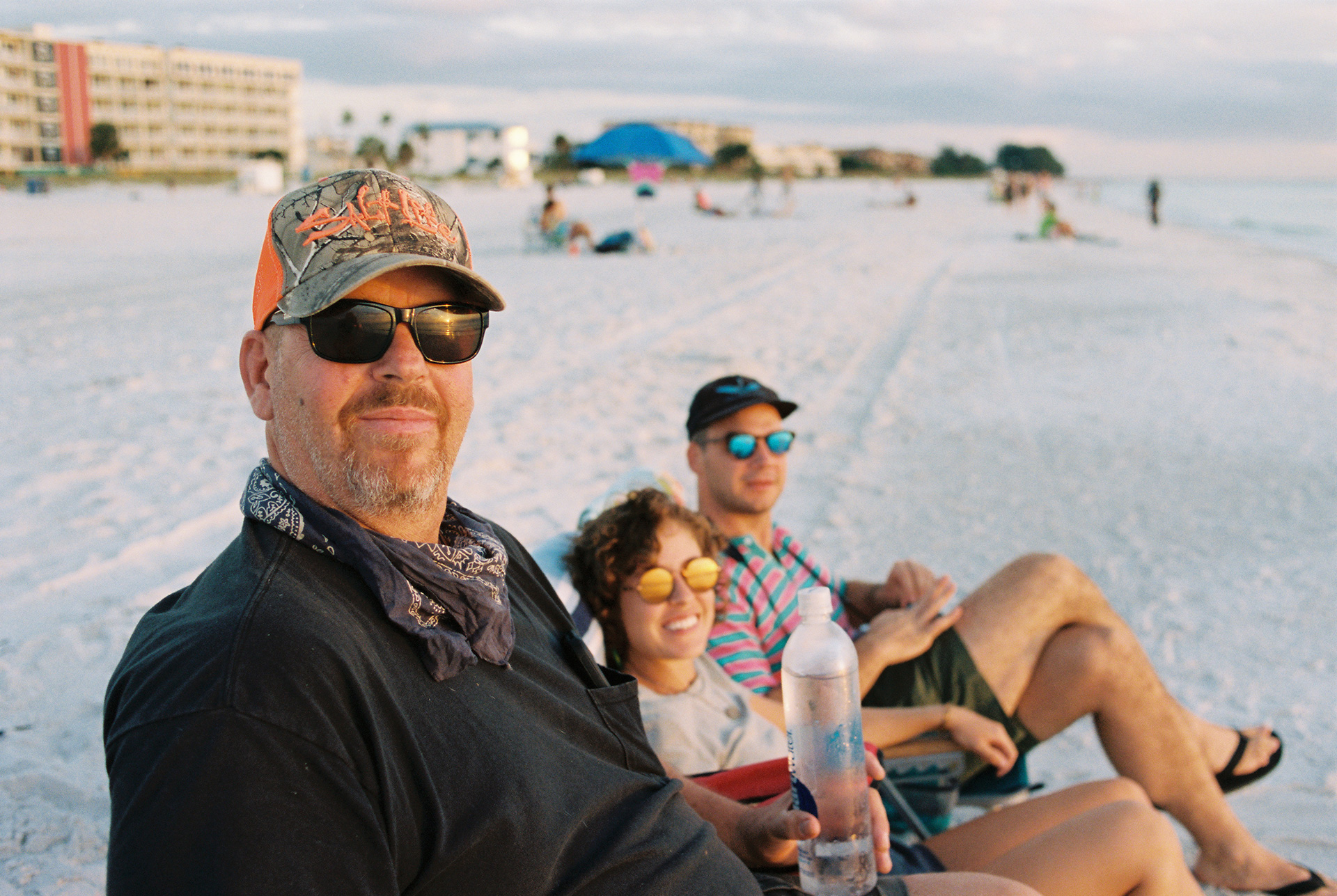 Henry, Jodi and Gresham watch the sun set over Treasure Island. (Photo by Ethan Payne)