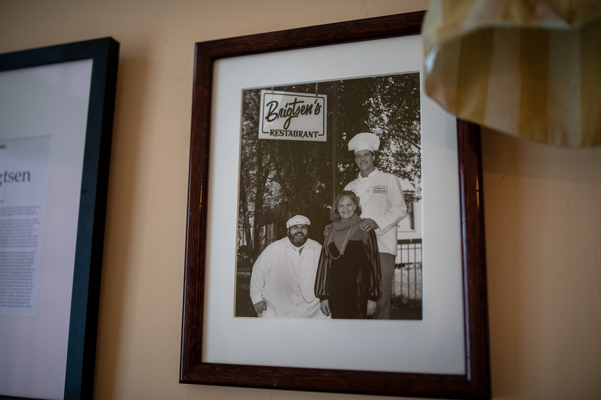 On the wall of their restaurant hangs an old photo of the Brigtsens with their mentor, Chef Paul Prudhomme.