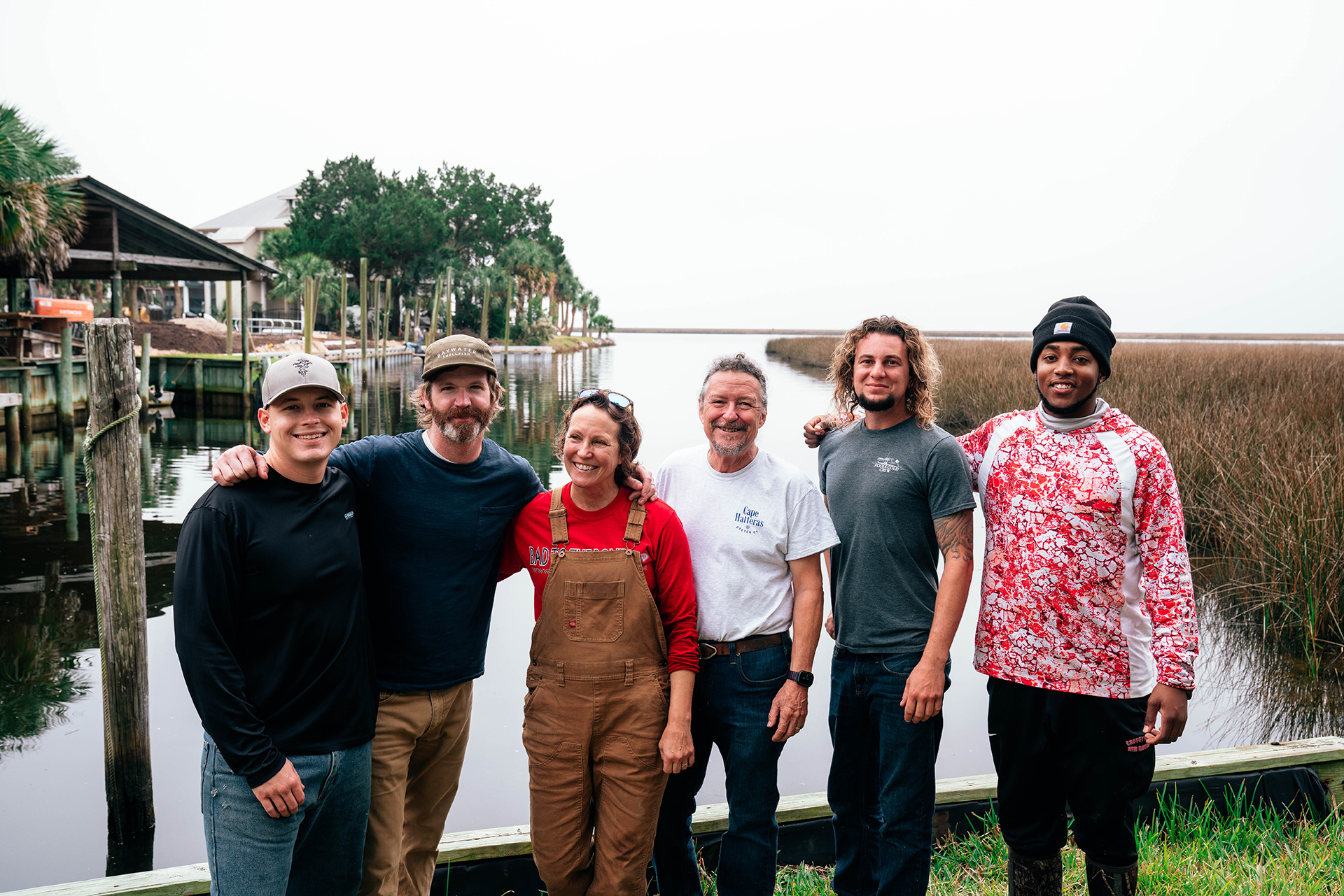 Jody and Dewey (center) with members of their team and other members of the Spring Creek collective of oyster farmers — Connor Whitfield, Bryan Rackley,  Matt Michalski and Adrian Morris.