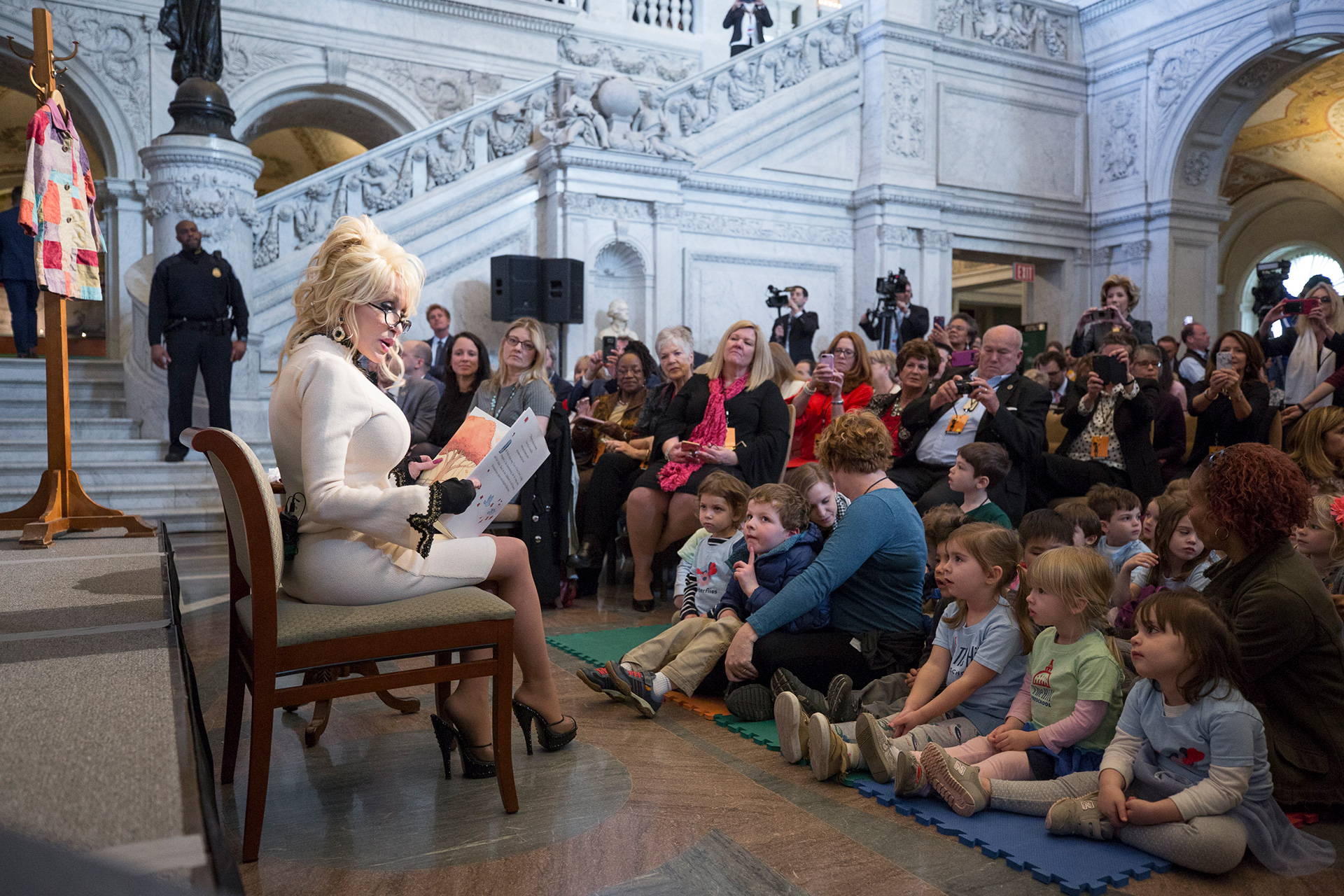 CONDENSED-imagination-library-of-congress-2018 Dolly reads to children at the Library of Congress in 2018 to mark the 100 millionth book given to kids through her Imagination Library program (photo courtesy of Dolly Parton)