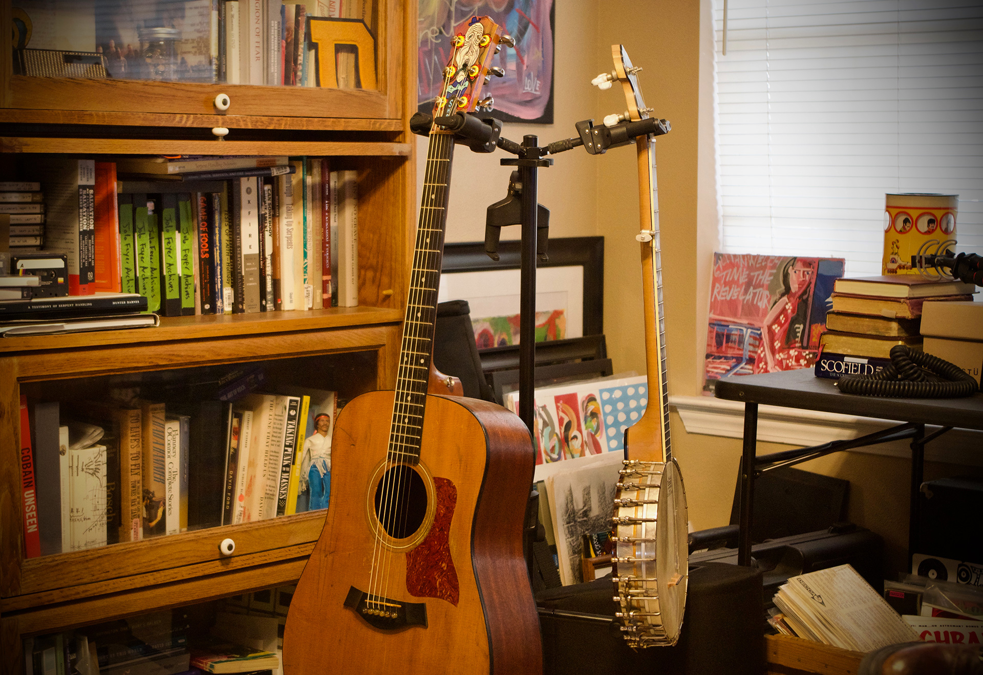 CONDENSED-partridge-guitar-stand Abe's guitar and banjo (photograph by Eli Bartlett)