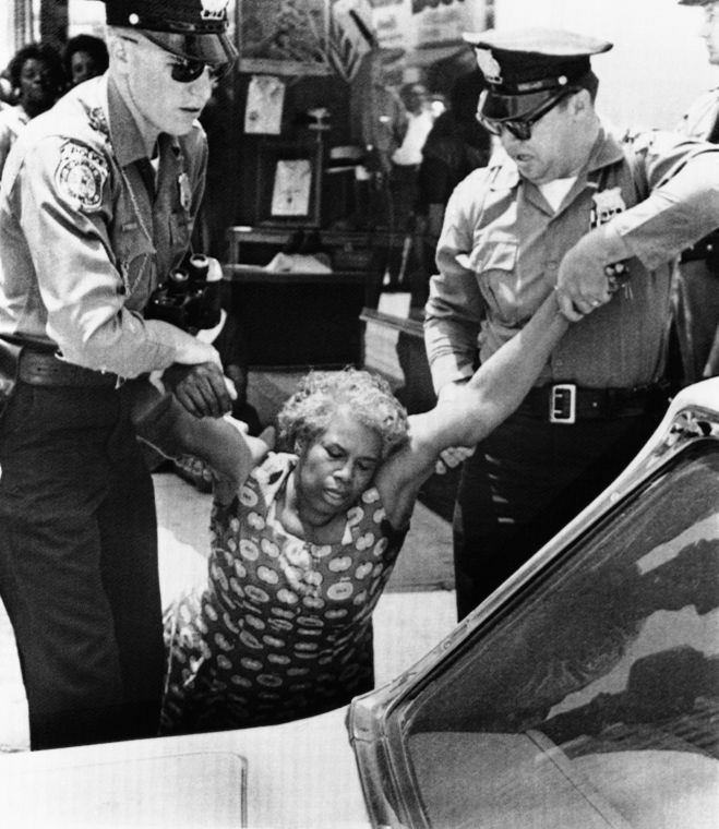 Danville, Virginia, police, drag an African American protestor in 1963's "Bloody Monday" protest.