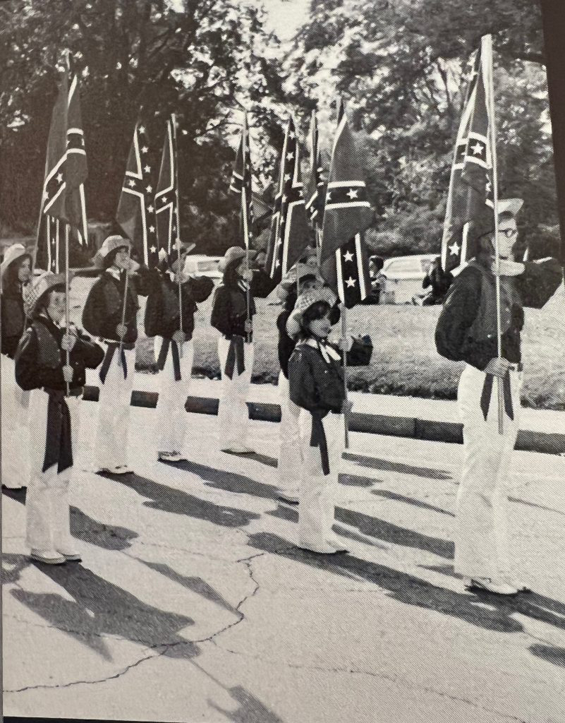 In the Kirk Academy homecoming parade in 1972, middle and elementary school children marched in confederate uniforms, holding confederate flags. (Courtesy of The Admissions Project Digital Archive)
