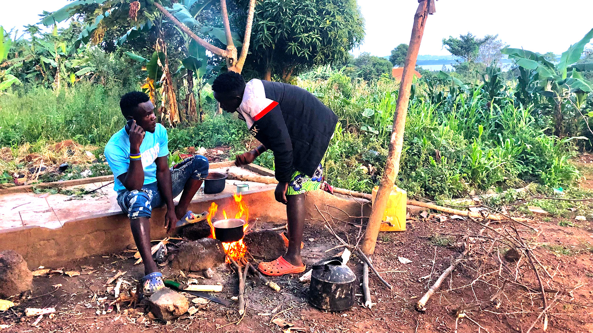 Cooking posho over a fire in Uganda
