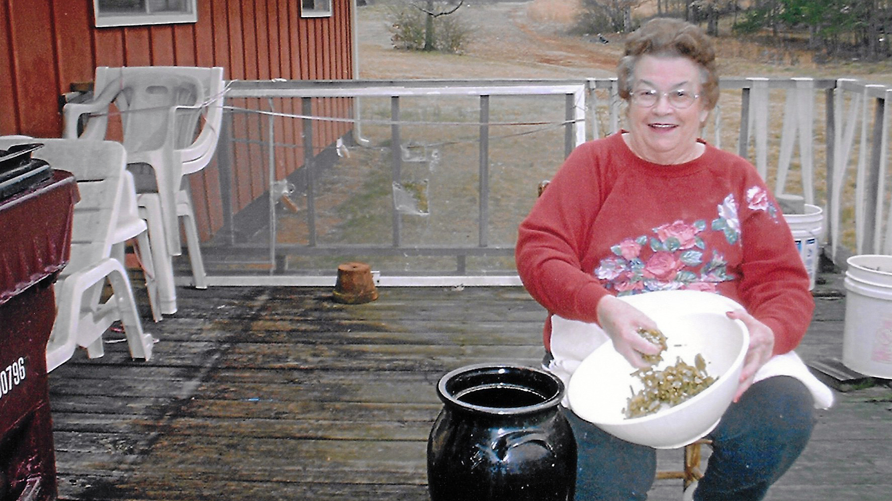 Myrtle West, the author's late grandmother, with a bowl of beans and her pickling churn